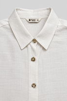 DEMI ASYMMETRICAL GATHERED SHIRT WITH STATEMENT BUTTONS - Sunday Story